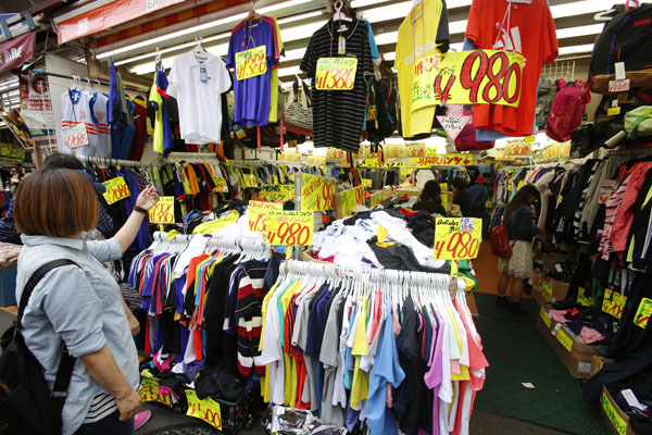 In this May 16, 2016 photo, shoppers choose clothes at Ameyoko shopping district in Tokyo (AP photo)